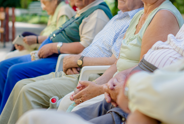 Older adults sitting on a bench. SESLHD PHU provides support and advice to aged care facilities and older adults on infection control and outbreak management