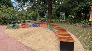 Image of Yarning Circle spotted gum boomerang seat